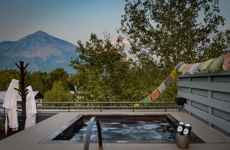 Snack on small bites and well-deserved beers in the sunshine back at the lodge